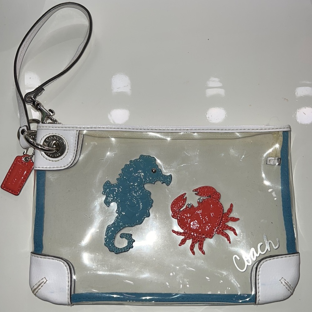 Large Coach Seahorse & Crab clear vinyl wristlet.
